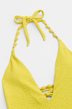 Maillot de bain une pièce jaune bas échancré